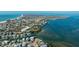 Expansive aerial view of waterfront homes, featuring bay views and convenient access to the Gulf at 236 S Harbor Dr, Holmes Beach, FL 34217