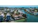 A waterfront home showcasing an outdoor swimming pool and private dock, perfect for boats at 236 S Harbor Dr, Holmes Beach, FL 34217