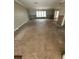 Bright and airy living room is waiting for your vision to come to life with ample natural light from a large window at 236 S Harbor Dr, Holmes Beach, FL 34217