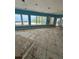 Bright living room featuring stunning ocean views from large windows, awaiting your personal design touches at 236 S Harbor Dr, Holmes Beach, FL 34217