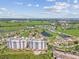 High-rise condos with a pool overlooking a golf course and green landscape at 2825 Terra Ceia Bay Blvd # 1804, Palmetto, FL 34221
