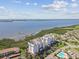 Beautiful aerial view of the condo building, the bay, and the surrounding landscaped grounds at 2825 Terra Ceia Bay Blvd # 1804, Palmetto, FL 34221