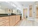 Large bathroom featuring double vanity with granite countertop, wood cabinets, and shower at 2825 Terra Ceia Bay Blvd # 1804, Palmetto, FL 34221