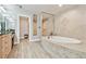 Bright bathroom with a jacuzzi tub and patterned tile flooring at 2825 Terra Ceia Bay Blvd # 1804, Palmetto, FL 34221