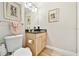 Bathroom with decorative wall art, wood-look flooring, and a wooden vanity at 2825 Terra Ceia Bay Blvd # 1804, Palmetto, FL 34221