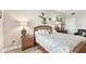 Comfortable bedroom featuring wooden furniture, decorative accents, and soft, inviting bedding at 2825 Terra Ceia Bay Blvd # 1804, Palmetto, FL 34221