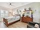 Well-lit bedroom with decorative accents, wood-look flooring, and a ceiling fan at 2825 Terra Ceia Bay Blvd # 1804, Palmetto, FL 34221