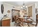 Formal dining room featuring a classic chandelier, elegant decor, and a beautiful china cabinet at 2825 Terra Ceia Bay Blvd # 1804, Palmetto, FL 34221
