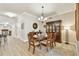 Formal dining room featuring chandelier lighting, a china cabinet, and beautiful area rug at 2825 Terra Ceia Bay Blvd # 1804, Palmetto, FL 34221