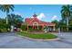 Elegant community entrance with a red-tiled roof, manicured landscaping, and stately architecture at 2825 Terra Ceia Bay Blvd # 1804, Palmetto, FL 34221