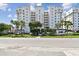 Exterior view of the condo building, showcasing its architecture and tropical landscaping at 2825 Terra Ceia Bay Blvd # 1804, Palmetto, FL 34221