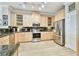 Well-lit kitchen featuring stainless steel appliances, granite countertops, and custom cabinetry at 2825 Terra Ceia Bay Blvd # 1804, Palmetto, FL 34221