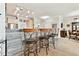 Spacious kitchen featuring a breakfast bar with seating, stainless appliances, and wood-look tile floors at 2825 Terra Ceia Bay Blvd # 1804, Palmetto, FL 34221