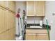 Laundry room featuring built-in cabinetry, sink with granite countertop and plenty of storage space at 2825 Terra Ceia Bay Blvd # 1804, Palmetto, FL 34221