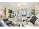 Spacious living room featuring comfortable leather seating, elegant decor, and a view of the outdoor balcony at 2825 Terra Ceia Bay Blvd # 1804, Palmetto, FL 34221