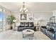 Bright living room featuring a leather sofa set, marble coffee table, chandelier, and decor at 2825 Terra Ceia Bay Blvd # 1804, Palmetto, FL 34221