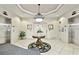 Well-maintained lobby area with decorative floral arrangement, overhead lighting and elevators at 2825 Terra Ceia Bay Blvd # 1804, Palmetto, FL 34221