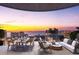 Expansive balcony featuring dining and seating with stunning sunset and water views at 290 Cocoanut Ave # 6A, Sarasota, FL 34236