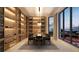Elegant dining room with a large wine cellar and city views at 290 Cocoanut Ave # 8B, Sarasota, FL 34236