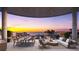 Expansive patio with stylish outdoor seating, dining area, and scenic city views at sunset at 290 Cocoanut Ave # 8B, Sarasota, FL 34236