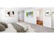 This bedroom features cozy carpet, neutral walls, and modern art pieces for a clean and calming atmosphere at 3219 Bitterroot Ln, Lakewood Ranch, FL 34211