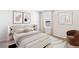 The natural light fills this bedroom with lake views, side table lamps, and modern art to create a calming atmosphere at 3219 Bitterroot Ln, Lakewood Ranch, FL 34211