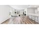 Bright living room with plank floors, modern furnishings, and sliding glass doors to the backyard at 3219 Bitterroot Ln, Lakewood Ranch, FL 34211
