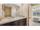 Well lit bathroom with double vanity, modern fixtures, and a large mirror at 3278 Rock Sound St, Bradenton, FL 34208