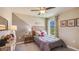 Comfortable bedroom with rustic wood headboard, gray and beige color scheme, and outside view at 3278 Rock Sound St, Bradenton, FL 34208