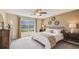 Spacious bedroom featuring a large window with pond view, soft neutral tones, and carpeted floors at 3278 Rock Sound St, Bradenton, FL 34208