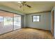 Spacious bedroom with sliding glass doors leading to the outdoor patio and a ceiling fan at 3303 Cambridge W Dr, Bradenton, FL 34205