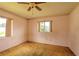 This is a bedroom featuring natural light from two windows and outdated carpet at 3303 Cambridge W Dr, Bradenton, FL 34205