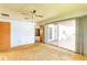 Bright bedroom features sliding glass doors to an outdoor patio, a ceiling fan and direct access to the bathroom at 3303 Cambridge W Dr, Bradenton, FL 34205