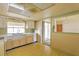 Well-lit kitchen with a view into the living area, ready for your personal touches at 3303 Cambridge W Dr, Bradenton, FL 34205