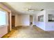 A large living room space with a view into the kitchen, full of potential at 3303 Cambridge W Dr, Bradenton, FL 34205