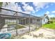 A screened-in pool area with an algae covered pool at 3303 Cambridge W Dr, Bradenton, FL 34205
