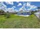 The backyard features a pool, lawn, and privacy fence at 3339 Duar Ter, North Port, FL 34291