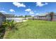 Expansive backyard featuring a well-maintained lawn and a refreshing in-ground swimming pool at 3339 Duar Ter, North Port, FL 34291