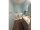 Bright bathroom with a walk-in tub, modern vanity, and stylish fixtures at 3339 Duar Ter, North Port, FL 34291