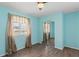 Bedroom with wood-look floors, natural light and mirrored closet doors at 3339 Duar Ter, North Port, FL 34291