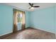 This bedroom features wood-look floors, natural light and soft blue walls at 3339 Duar Ter, North Port, FL 34291