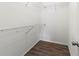 Walk-in closet features wire shelving and wood-look flooring at 3339 Duar Ter, North Port, FL 34291