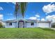 Charming single-story home with a well-maintained lawn, screened-in front porch, and solar panels at 3339 Duar Ter, North Port, FL 34291