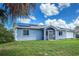 Charming single-story home with a well-maintained lawn, screened-in front porch, and solar panels at 3339 Duar Ter, North Port, FL 34291