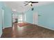 Bright living room with wood floors and stainless appliances showcasing an open floor plan for entertaining at 3339 Duar Ter, North Port, FL 34291
