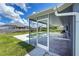 The covered patio offers views of the pool and yard at 3339 Duar Ter, North Port, FL 34291