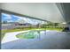 The covered patio sits adjacent to the pool at 3339 Duar Ter, North Port, FL 34291