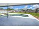 Backyard with a refreshing pool, patio area, fenced-in yard, and lush landscaping perfect for outdoor enjoyment at 3339 Duar Ter, North Port, FL 34291