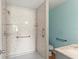 This shower features built in shelving, grab bars and marbled walls at 3339 Duar Ter, North Port, FL 34291