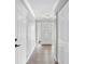 Bright foyer features wood-look flooring and an ornate glass front door with fresh, neutral paint at 3631 Palm Dr, Punta Gorda, FL 33950